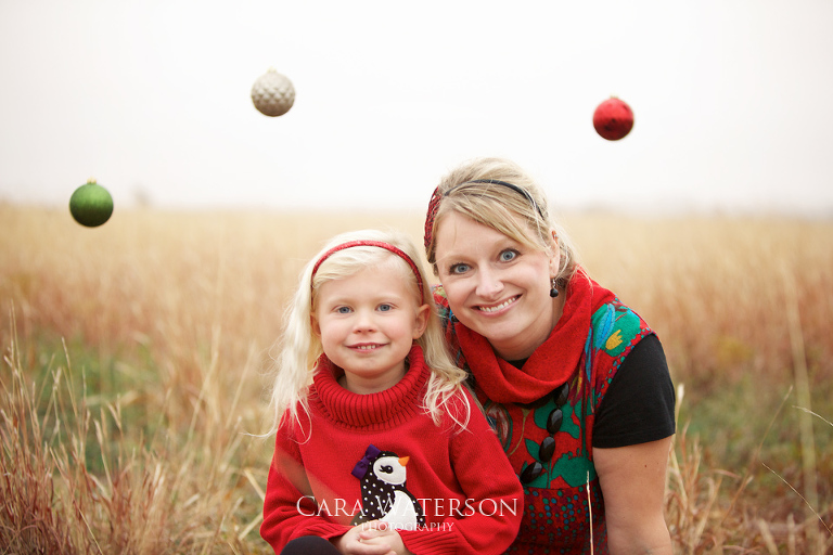 mom and daughter with christmas baubles