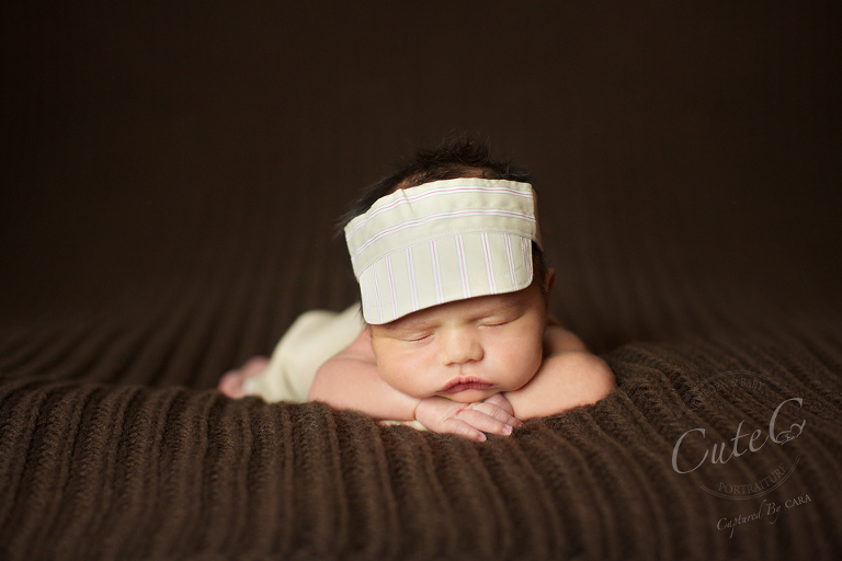 newborn on brown in visor