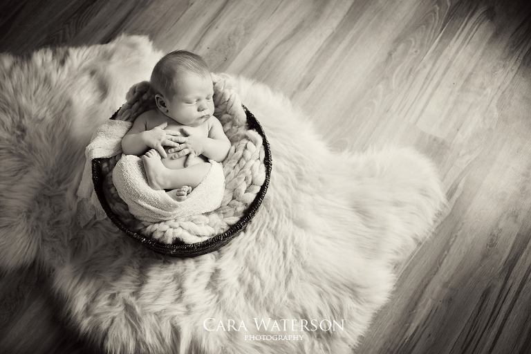 b&w baby in basket