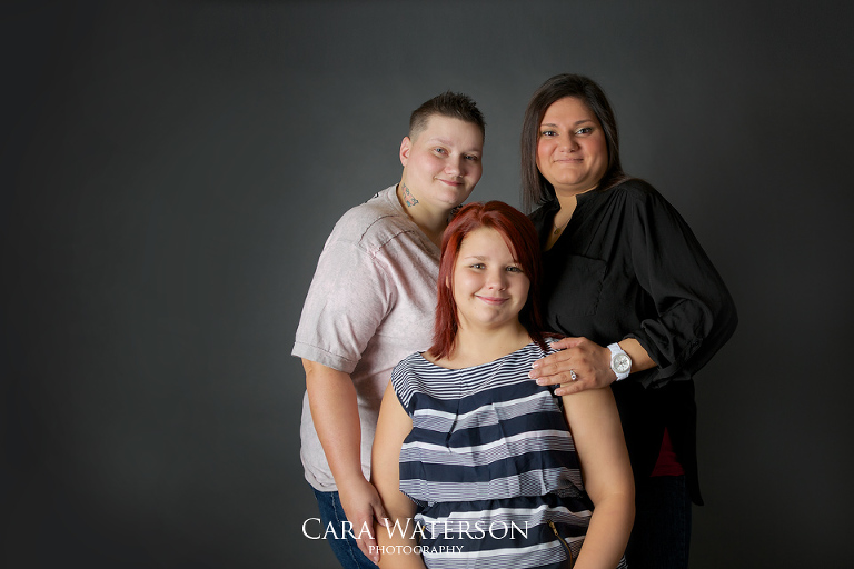 family on grey backdrop