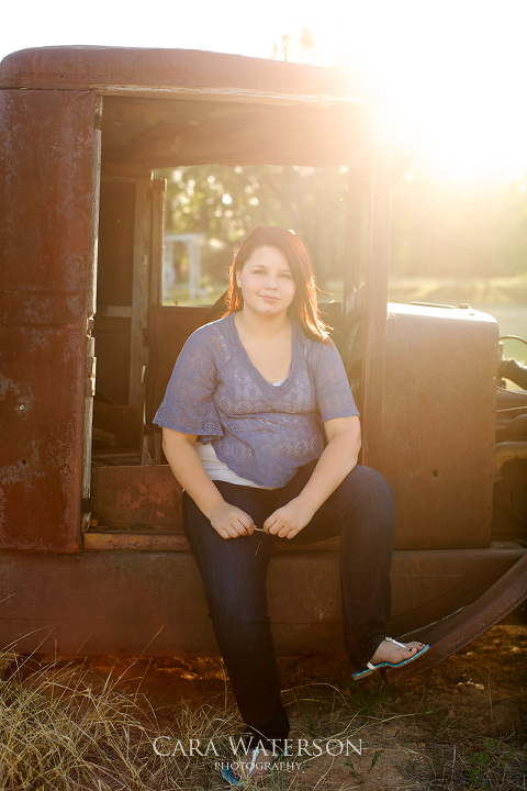 girl on rusted truck