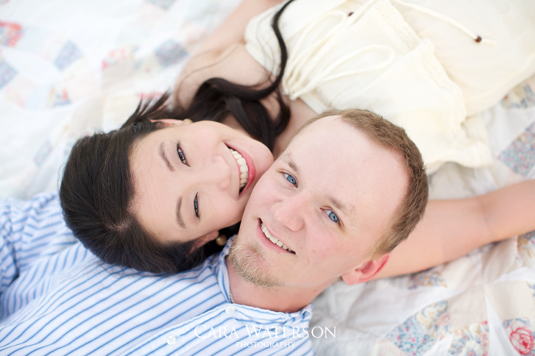 smiling couple on a quilt