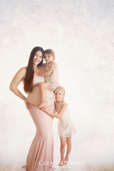 expectant mom and her daughters