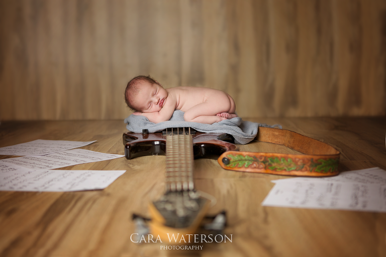 baby on dads guitar