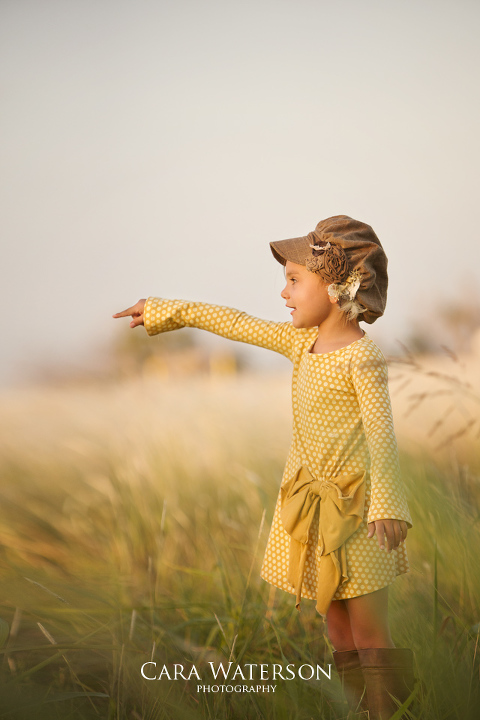 girl in yellow dress in field