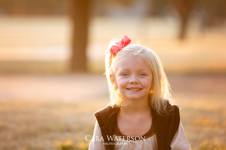 blonde girl with a bow