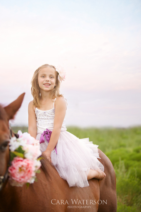 girl on a horse with flowers